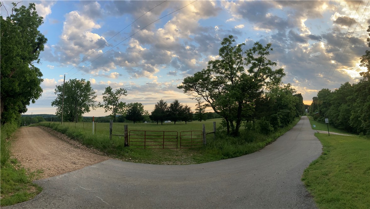 3 beautiful acres, making a grand corner lot - Directly across from the entrance to the Rob and Melanie Walton Nature Preserve (for foot and bike traffic only). This lot has a well (verify functioning) or city water at the road and electric, and is virtually ready to have your custom home built to your specs on this really level, buildable and usable acreage off of a paved road. Retain some personal space and still have easy access to all things NWA - just 2 to 3 minutes to Hwy 62, 15 minutes to Lost Bridge Marina and access to Beaver Lake, 15 minutes to Rogers Municipal Airport, a short drive to NWACC, the new Walmart Campus, and all things Bentonville. What an amazing find! Virtually builder-ready!