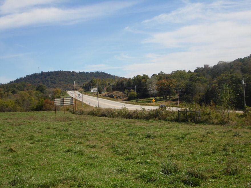 Beautiful farm land but also great commercial development potential with very visible frontage on Hwy. 62.  Gorgeous rolling land with views and some woods.