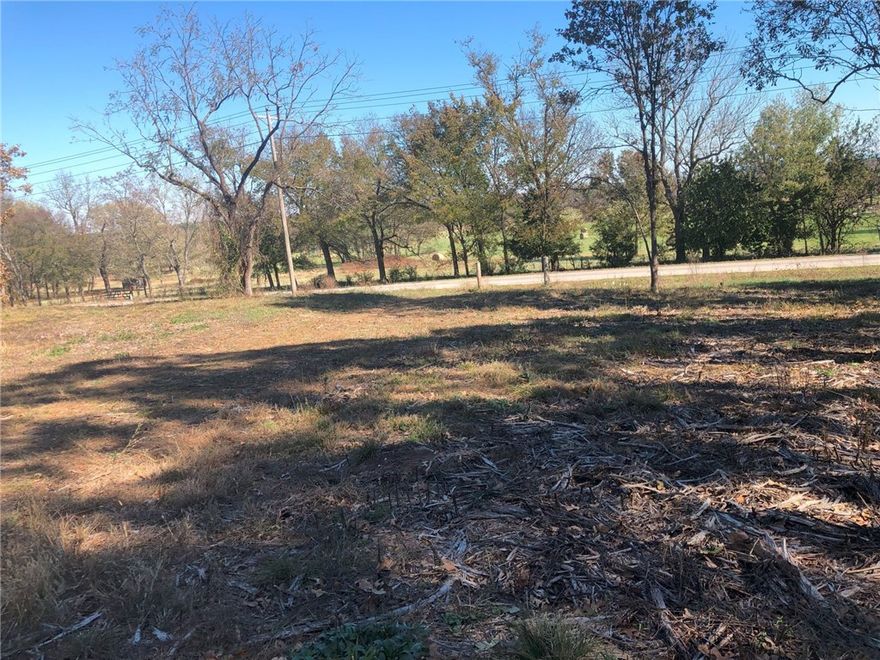 What a wonderful site for recreation! 5 acres to build your dream house with timberland behind for great hunting. Prairie Grove schools. Close to Hwy 16 where you can easily go to Siloam Springs or Fayetteville. See MLS 1261618 for additional 5.07 acres