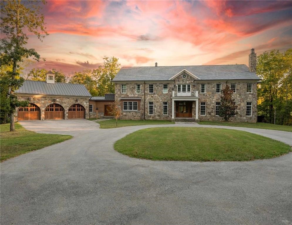 Set amidst the rolling hills of North Bentonville, 10760 Sugar Creek Road spans 12 acres of stunning woodlands and meadows, blending luxury with year-round natural beauty. The main residence offers 5 beds, 3.5 baths, and 8,128 SF of timelessly elegant living spaces.
Naturally bright interiors feature 11-ft ceilings, skylights, wood and marble flooring and a kitchen boasting Arkansas’s first Lacanche French range. The primary suite includes vaulted ceilings, a fireplace, and a spa-like ensuite bath.
Outdoors, enjoy your very own pristine forests, a fruit orchard, a greenhouse, and a shop with a separate art studio. A sanctuary for native flora and fauna, this estate offers peace and exciting potential— all just 15 minutes from downtown Bentonville and 15 minutes from a private airport.