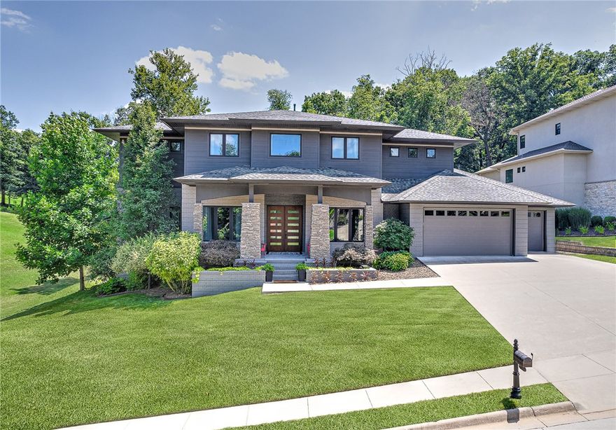 Introducing custom-built home by Mark Phillips, situated on an oversized 0.41-acre golf-front lot w/ a Golf membership included. This modern architectural masterpiece offers 12 ft high ceilings, 8 ft doorways, and a wine room wired for climate control. The main level features a spacious office, Primary suite, a guest bedroom with a full bath, and a chef's kitchen with a 12 ft island that flows beautifully into the family room w/ fireplace and built-in bench. Second Level offers 2 bedrooms, both with ensuite baths, loft space, half bath + 821 sq ft bonus room with 325 of those ft dedicated to a putting green and room for a Golf simulator, bonus room is also pre-plumbed for a bar. The upper balcony offers stunning views! Custom lighting, CAT5 wiring, and interior/exterior speakers enhance the ambiance. Outside, enjoy a gunite pool ith a swim-up bar, potential water feature, volleyball net, outdoor kitchen & fire table. This property with a 4 car garage combines luxury and functionality in one remarkable package.