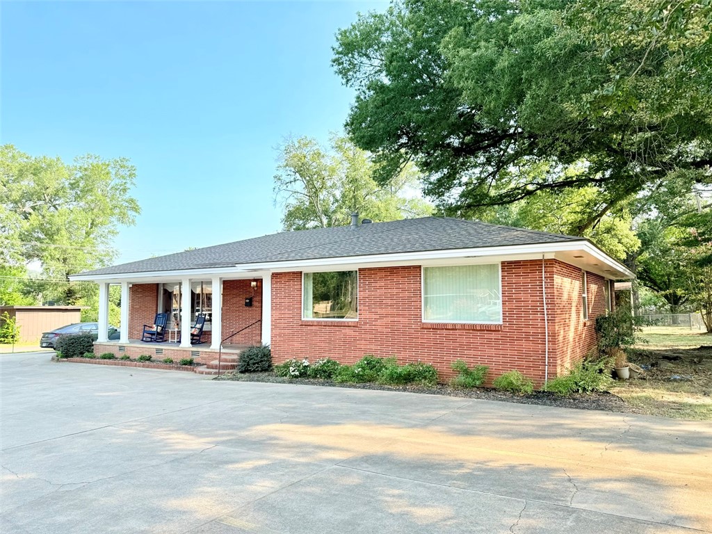 Commercial Opportunity on West Main! Located at 2802 W Main St in the heart of Russellville, this versatile property offers a prime space for office or business use with great visibility and convenient access. The main level features a welcoming open space perfect for a reception or waiting area. There is a dedicated receptionist office straight ahead, and just off the entrance is a small conference room to the left. Two full bathrooms are located on the main floor, along with two private offices and a kitchen area for staff use. Step down into the addition, where you'll find a spacious private office and an open-concept office area with a half bathāperfect for collaborative work or expanding your team. Thereās also a lower-level space (not a full basement), currently used for storage, with an additional half bath (not in use). The property offers a good parking area suitable for both staff and clients, making this a functional and well-situated space for your growing business.
