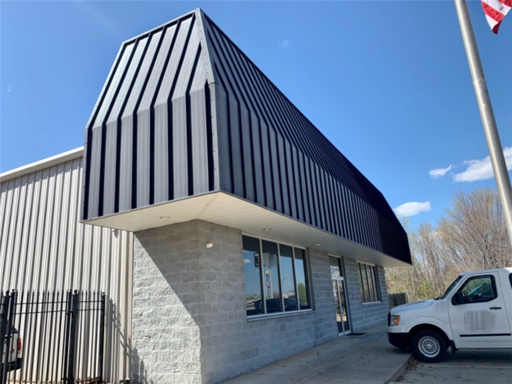 Turnkey investment opportunity! A 5-year Triple Net Lease started in 2021 and was written with an additional 5-year option to extend the Lease, with an agreed upon rent increase. Excellent condition 7,560 sq ft building. 3,000 office space, 4560 warehouse. Upgraded LED lighting in warehouse, Heat/Air extended throughout entire building on multi units for area temp control. Wired 3 Phase bldg. Upgraded Fiber Optic ran into bldg. with Uninterrupted Dedicated fiber. Close circuit Camera system with independent dvr with online access. A 12 camera Alarm system, monthly service paid by tenant. 3 large offices and oversized conference room. 6- 14x14 overhead doors, storage rooms. Large reception area. 3 bathrooms. A kitchenette. Building is situation on 1.62 acres with 53 parking spaces, completely fenced, privacy with 3 row barb wire, plus 2 wrought iron gates for access and security. Parking lot lighting. Across street from restaurants and Hwy 49 access!