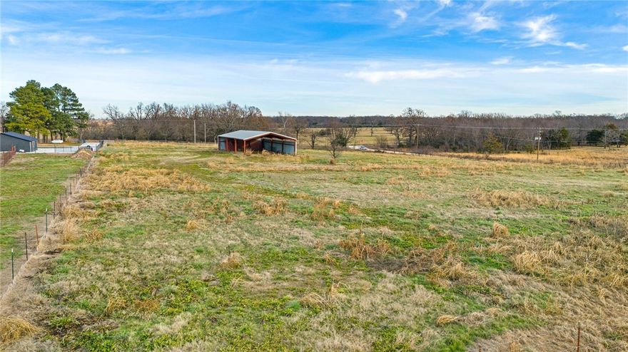 Enjoy the perfect blend of peaceful country space and everyday convenience on this prime 5.2-acre corner parcel at Benson Road and HWY 72, just five minutes west of downtown Gravette. It’s easy to soak up the quiet of rural living while still being close to shopping, schools, and all the surrounding Northwest Arkansas communities.

With plenty of room to build and water and electric available at the street, you can bring your vision to life with ease. A 40' x 75' red iron pole barn on site conveys with the property—ideal for storage, equipment, hobbies, or a future workshop. The metal pieces in the barn do not convey.
No mobile homes.