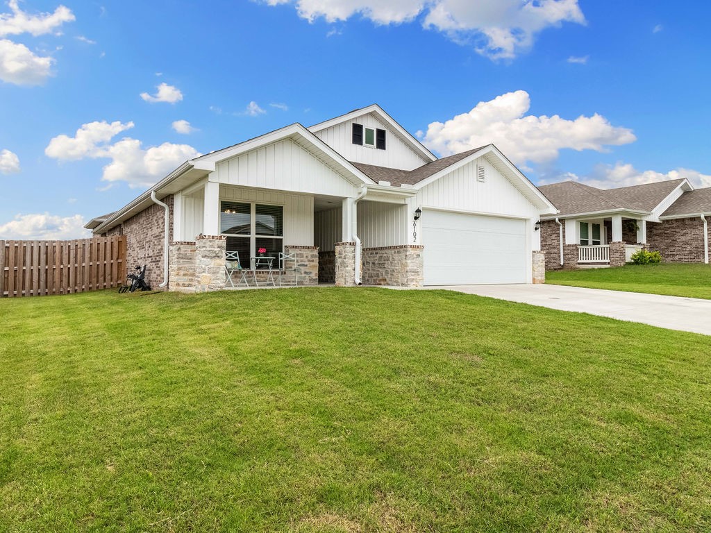 Step into this well maintained 3 bedroom 2 bathroom home built by Schuber Mitchell in 2022. With a combination of soaring ten foot ceilings and large windows, the open concept core is instantly welcoming and bright. The space is topped off with elegant granite countertops, wood look tile flooring, and a cozy electric fireplace. The primary bedroom has a large en suite bathroom with dual vanities, separate tub, and shower with large closet that cuts through directly to the laundry room. Stepping outside through the backdoor, you will find a covered back patio with a fenced backyard with no neighbors behind for ample privacy in a subdivision. So if you are looking for a well built, well cared for home that is only a few years old, then put this one on the list and set up a private showing for yourself today. Ask for the walk through video link.