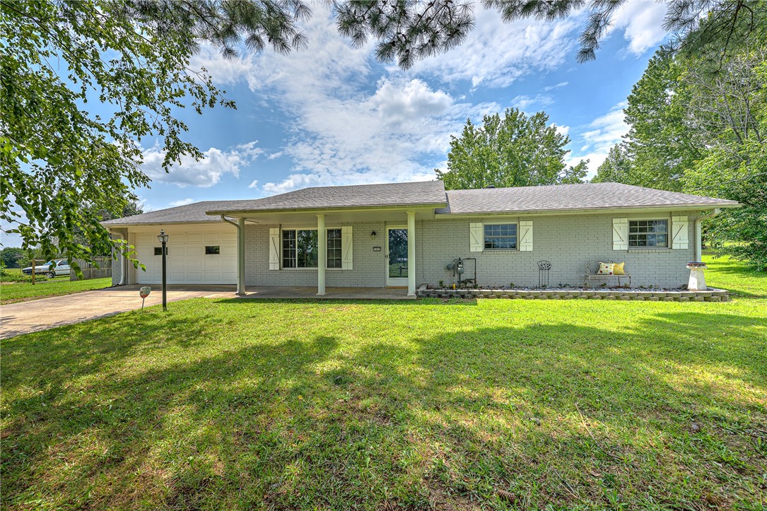 Welcome to 2409 Reed Ave in Springdale, AR! This charming 3-bedroom, 2-bathroom home features a 13x16 bonus room and a newly added four-season sunroom (2023), perfect for year-round enjoyment. Situated on a spacious .79-acre lot with a fenced yard, this property offers an ideal blend of indoor and outdoor living. The home includes a 1,200 sq. ft. heated shop building with two remote doors and a service door, built in 2019, perfect for projects or additional storage. Recent renovations include a modern kitchen and updated primary bathroom, ensuring a move-in-ready experience. Additional features include two driveways with a turnaround, an oversized 2-car garage, a new roof (2019), new HVAC (2019), new exterior paint (2019), and fresh interior paint. This home provides ample space, comfort, and modern amenities, making it a perfect choice for your next home.
