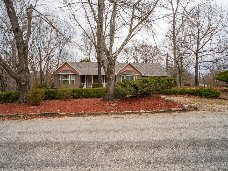 Welcome to your new home in the sought-after Hyland Park neighborhood! This charming residence offers the perfect balance of tranquility and convenience, located near the picturesque Lake Atalanta and downtown Rogers. Short 10 minute drive to Beaver Lake. Nestled on a spacious 1.79-acre corner lot in a peaceful subdivision, this property is surrounded by mature trees, creating a private retreat. Inside you will find a beautifully updated home featuring three bedrooms, two bathrooms, an office, and a formal dining room. Recent upgrades include updated master bathroom, flooring and a brand-new roof (installed July 2024). The expansive back deck is perfect for outdoor entertaining or simply enjoying the natural beauty of the surroundings. Additionally, the property includes a detached, partially finished heated and cooled building, complete with plumbing, a shower, and a toilet. This versatile space offers endless possibilities ideal for a guest house, workshop, or creative studio.
