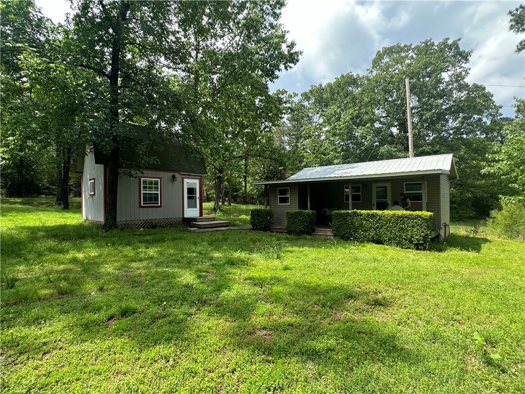 Nestled on 5.4+/- acres of calm countryside, this property is the perfect blend of privacy & convenience. You'll find multiple structures serving various needs/desires.
First, a cozy 360ft² 1BR/1BA cabin-ideal for peaceful retreats/weekend getaways. Nearby is a 192ft² cabin w/ a kitchen & loft for additional living space. Next, a 24x36 shop with a 27x36 overhang for extra storage awaits. Need space for your vehicles/equipment? Check out the 30x30 2-car garage with extra space! For a slower pace-a gazebo overlooking a tranquil pond is the perfect spot for relaxation/reflection.
You’ll find a 1,700ft² block frame for building w/ city water, septic, & electricity already on property. Hello Dream Home!
Hise Landing, your gateway to adventure, is just 7 miles away. Enjoy boating, fishing, picnicking, & sightseeing. Plus, a hunter’s dream spot 1 hour away at Ouachita National Forest!
Whether you're seeking a homestead or dreaming of building a dream home, this property is an excellent opportunity!