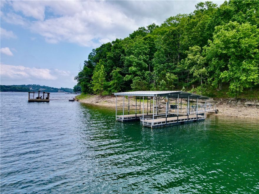 Lakefront living at its finest on beautiful Beaver Lake! This stunning lake home is tucked in a peaceful cove and includes a private boat dock with lift and solar power—perfect for easy days on the water.

Enjoy the outdoor lifestyle with a spacious firepit area, two large decks with breathtaking views, and direct lake access for boating, fishing, and swimming. Ideal for entertaining or relaxing at sunset, this property offers the ultimate lake retreat.

Turn-key and move-in ready, the interior features granite countertops, extensive custom woodwork, and a whole-house generator for year-round peace of mind. The fully refinished basement includes a bonus room—perfect for a game room, office, or extra sleeping space.

With its layout and amenities, this home also offers excellent short- or long-term rental potential. Don’t miss this rare opportunity to own your own slice of lakefront paradise! (Preapproval letter is required.)