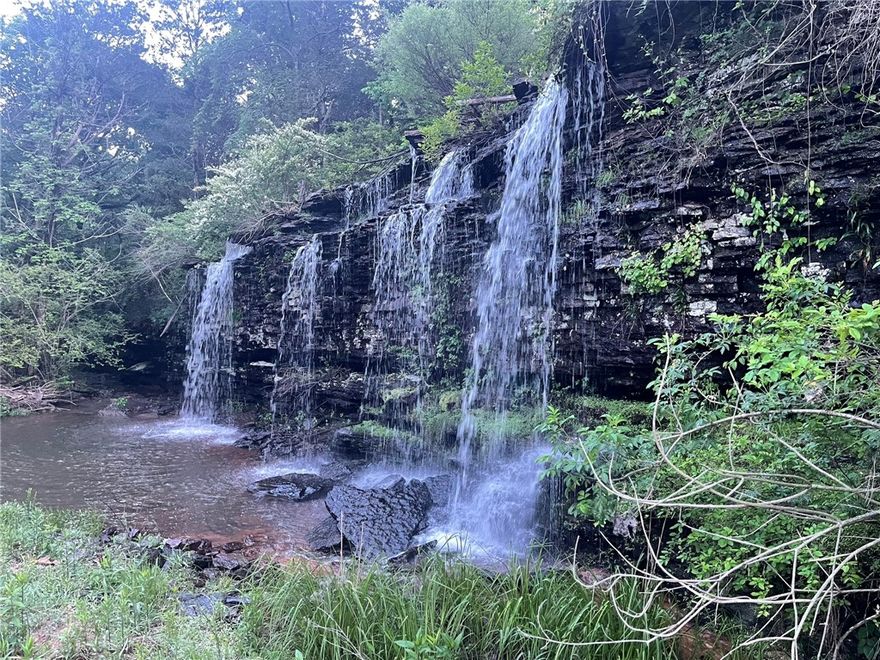 Escape to the Ozarks with this rare opportunity to own 218 acres of natural beauty at Lost Trails Ranch. This turnkey property blends serene wilderness with modern comfort, featuring miles of private trails, a spring-fed lake, creeks, and a stunning waterfall.

The ranch includes four fully equipped lodges—Fireside, Foothills, Foxhaven, and Bearclaw Lodge. It also features a administrative building and gym with a stage area. Designed for both personal enjoyment and income potential, it’s ideal for weddings, retreats, and events.

Recreation abounds with hiking, biking, kayaking, and wildlife watching across varied terrain from pine forests to open meadows. Outdoor living areas, firepits, and large dining spaces make it perfect for gatherings.

Located near Mulberry and within 2 hours of major airports, Lost Trails Ranch offers seclusion with accessibility. Whether you're looking for a private escape, a retreat center, or an investment, this property delivers.

Visit losttrailsranch.com to learn more.