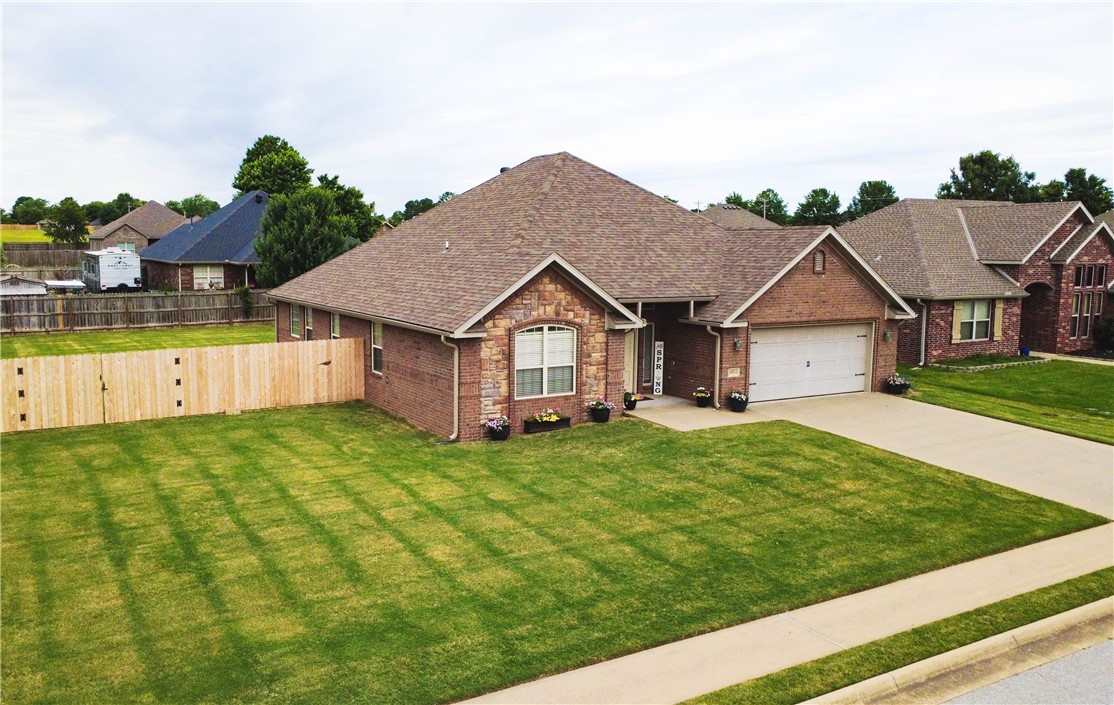 This move-in-ready 2010 home is well-maintained. The upgrades will give the new owner peace of mind for many years to come. New in 2019: Dishwasher, Gas Stove/Oven, and Interior Paint. New in 2020: Trane A/C Furnace. New in 2021: Roof. New in 2022: Garage Door Opener, New in 2024: Spring on Garage Door, Screen Door, Garbage Disposal, and complete fencing on 3 sides of backyard. A double gate on the front side allows for RV parking. Beautiful Brick home with some rock facade on a flat lot in a peaceful neighborhood near a pond and a playground. The backyard has plenty of room for entertainment dreams or even a pool. The front and back are landscaped and well-maintained. High school and elementary school are less than a mile away, but far enough to avoid noise. Upon entrance, you walk into a beautiful foyer with tile that transition onto wood flooring. Once in, you see the main living room with a gas fireplace and elegant crown molding. Home is a split floor plan with Primary towards the backyard. home is ready now.