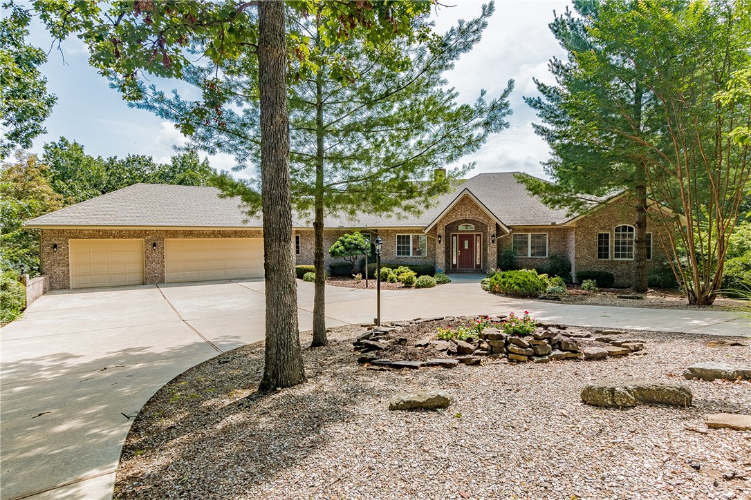 Welcome to a grand estate on the 13th tee box at Scotsdale Golf Club. This is luxury living at its finest! From the moment you enter the private club-de-sac and take the gently sloping 75 yard long circular driveway, you have entered a space that's both peaceful and serene. This Gene Knight built estate has hardwood flooring, floor to ceiling windows with magnificent views.Formal living and dining, plus a main floor office. The Master and another bedroom on the main floor with two more in the lower level. Live on the main level with plenty of room for the kids/grandkids in the lower level. A workshop and storage galore! This one has it all!!