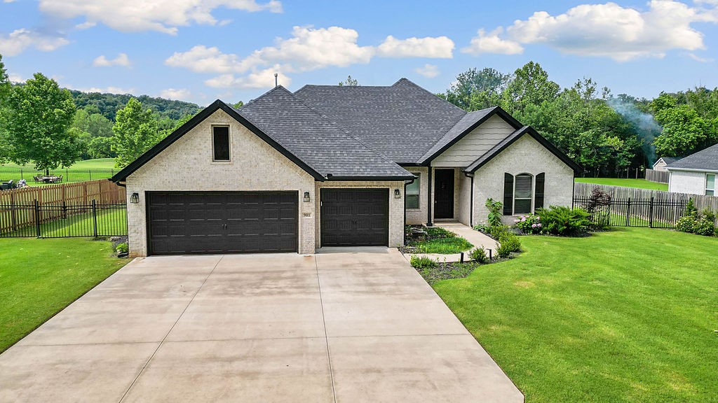 Agent-Owned! Upon entering the front door, you're greeted with a stunning view that stretches through the home, out the back windows, across the backyard to the golf course fairway. With no HOA, there is freedom to build a shop in the backyard that complements the aesthetics of the neighborhood. The flat, expansive backyard is a perfect canvasāideal for adding a pool or outdoor entertaining space. Thanks to the double lot, your property extends beyond the fence line all the way to the fairway, ensuring no rear neighbors.
Inside, the open-concept layout creates a warm and welcoming atmosphere in the heart of the home, while a separate dining area offers space for formal meals or gatherings. The split floor plan places the spacious primary suite on one side of the home, with the remaining three bedrooms on the other, offering privacy and flexibility. Close to gravel trails & Walmart HQ, downtown Bentonville/Rogers, and Bella Vista. Also close to the Rogers Municipal airport. Ask for 3d tour or schedule a showing!
