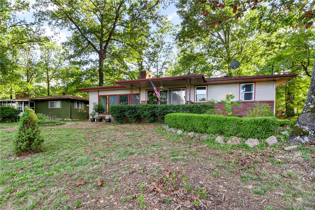 This 2 BR home offers plenty of living space. Partition off the large bonus room and create a 3rd bedroom. Large trees provide ample shade. Sit out on your spacious patio under the pergola. New; A/C 2010, Roof & Septic 2012, Siding 2011. Workshop in garage.