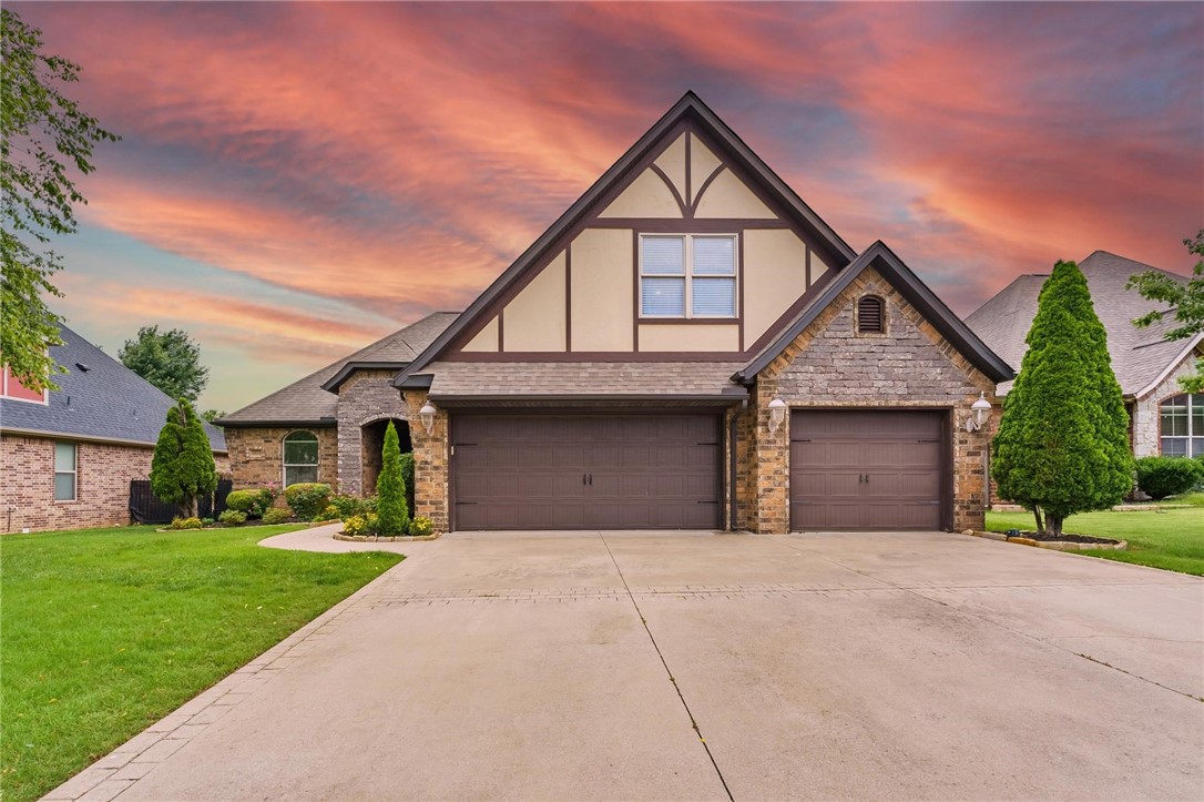 Perfectly situated in the vibrant Hearthstone neighborhood, served by Bentonville Schools, this home's main living areas impress with extended ceiling heights (12-15 feet), creating an airy and grand ambiance. The heart of the home is a gourmet kitchen, equipped with double ovens, a gas stove, stainless steel appliances, granite countertops, and custom cabinetry. Enjoy the elegance and ease of hardwood floors throughout the entire downstairs, with no carpet on the main level. A versatile office space with French doors offers adaptable living, perfect for work, hobbies, or play. Upstairs, a large bonus room with a full bath and closet provides incredible flexibility for a media room, guest suite, or a private sanctuary. Ample storage is found in the walk-in attic, and a spacious three-car garage provides abundant parking and extra room (includes storage racks and a TV). The outdoor living space is equally as impressive: a high-ceiling bark porch features granite counters, built in gas grill and stamped concrete.