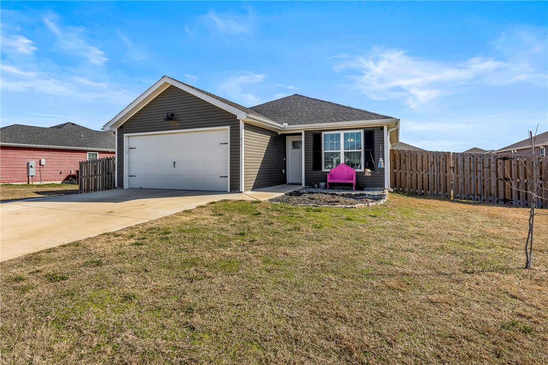 Step into the perfect blend of charm, modern design, and comfort with this beautiful 3-bedroom, 2-bath cottage-style home (built in 2021)! From the moment you walk in, youāll love the bright, open-concept layout featuring a spacious kitchen island, sleek granite countertops, and luxury vinyl plank flooringāperfect for hosting gatherings or simply enjoying everyday life. The split floor plan offers privacy, with a relaxing primary suite and walk-in closet. Natural light fills every corner, and the fenced backyard and security system add extra peace of mind. Ideally located close to everything and even Rural Development Loan eligible, this beautiful home is a must seeāschedule your tour today!