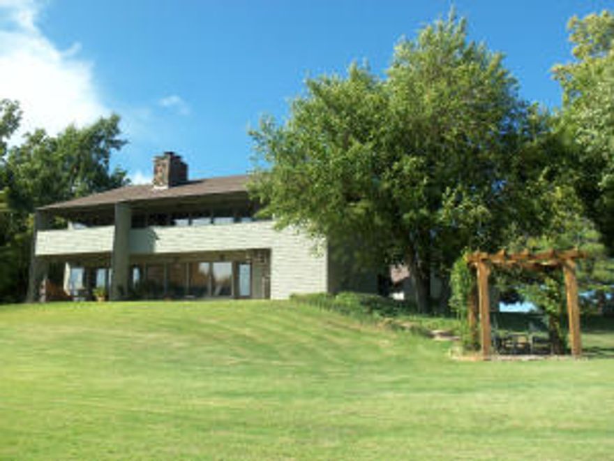 One of the premier estates in this area!  This awesome 4 bedroom, 4 bath home sits on top of the hill overlooking Harrison, an unbelievable view day or night!  135 acres with nice blend of improved pastures & woods.  The home has many unique features including some native stone floors, 2 stone fireplaces (one in master bedroom).  17 ft. high