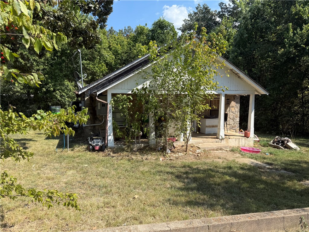 Charming stone exterior home with investment potential! This 3 bedroom, 1 bath property is currently being used as a rental and offers plenty of opportunity as a fixer upper. Features include central heat and air, spacious layout, and a classic stone façade. With updates and repairs, this home could make a comfortable residence or continue as a steady income-producing rental. Convenient location in Marshall close to schools, shopping, and downtown amenities.
