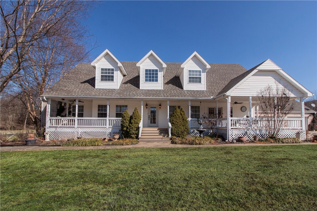 Relax in a park-like setting in this fantastic home in one of Farmington’s premier neighborhoods, Mountain View Estates! Look out upon your massive front yard as you sit on the over-sized, end-to-end front porch in a valley, half-surrounded by hills and an almost constant breeze. As you walk through the front door, be amazed by the view of the creek and woods behind the house through the 2-story wall of windows. This house is built for entertaining with a spacious kitchen with a huge island and a full size refrigerator on one end of the kitchen and a full-size standing freezer on the other side. Real hardwood flooring throughout the ground floor helps to create continuity and an open feel! The oversized master suite is on the ground floor and all other bedrooms are upstairs. Large bedrooms and tons of storage, with a three-car detached, heated garage connected by a covered breezeway, and over 500 feet of storage over the garage complete this phenomenal property!