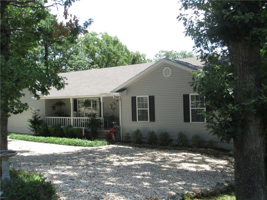 Home truly reflects pride of ownership. Meticulously maintained &  beautifully updated.Hardwood floors, granite counters throughout, tile shower, tons of storage space, great back deck to take in the mountain views. Inviting front porch to while away the hours.Sun filled owners quarters w/his & hers vanities, walk in closet & deck access. Huge living room is warmed by gas log fireplace. Bonus room off utility room can be office space. 2 beds/1 bath on lower level plus exercise room or whatever you desire.