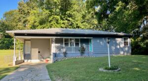 Well maintained two-bedroom 1 bath home with spacious living/dining combo, sitting on large lot in quiet neighborhood at the end of the street. Close to hospital and downtown. Vinyl plank flooring in kitchen, hallway and bathroom with carpet in living room and bedrooms. Chain link fenced backyard offers safety for children and pets.There is also a large basement with concrete floor for workshop and storage. Realtor lockbox in carport.