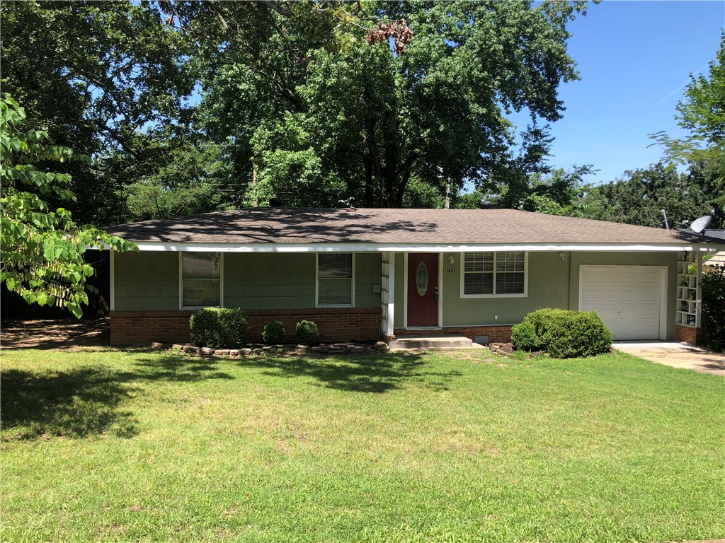 Welcome to 1231 N Oak Avenue, a charming home just 3 minutes from the University of Arkansas & 10 minutes to Northwest Arkansas Mall. This property boasts hardwood floors throughout. The eat-in kitchen is perfect for family meals, while the deck in the backyard provides an ideal space for outdoor relaxation & entertaining. Conveniently located near a variety of Fayettevilleās top amenities, this home puts you in the heart of it all. Enjoy quick access to local shops, restaurants, parks, & more. Whether you're a student, professional, or anyone in between, this home offers the perfect balance of comfort, location, & style. Sold As-Is.