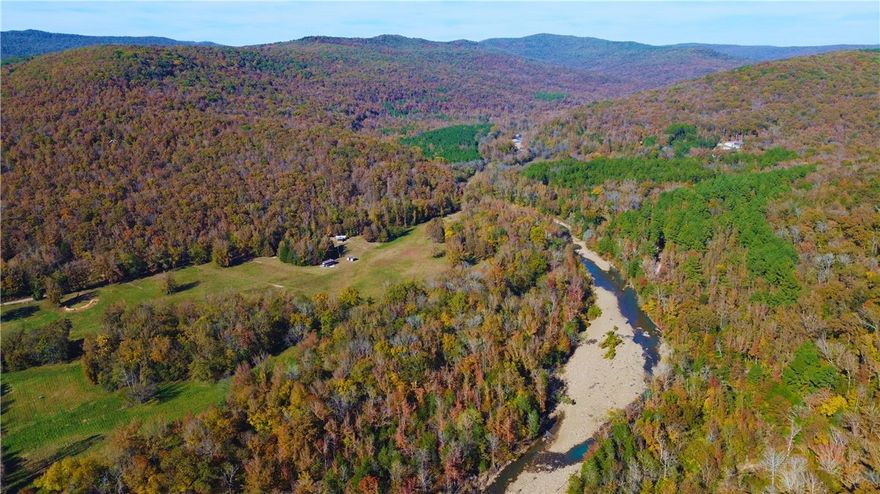 Don't miss out on your chance to own +/- 10 recently surveyed acres on the banks of Little Mulberry Creek located in the picturesque Little Mulberry Valley. Located 5.9 miles north of Hwy 215, this secluded tract offers a rare opportunity to be a part of this tight knit community. This area is known as Hazen Ford, & the views in this valley are truly postcard worthy. Approx. 528 feet of creek frontage and 3.3 acres of partially fenced pasture. National Forest in every direction for additional hunting, hiking and trail riding. The Ozark Highlands Trail crosses the entry road, just a couple of miles away. Very flat with direct access off CR 6151. Willing to split into two 5 acre sections. Electricity and fiber on site. Well and septic will be needed. You don't get opportunities for land like this very often. Survey attached to listing.