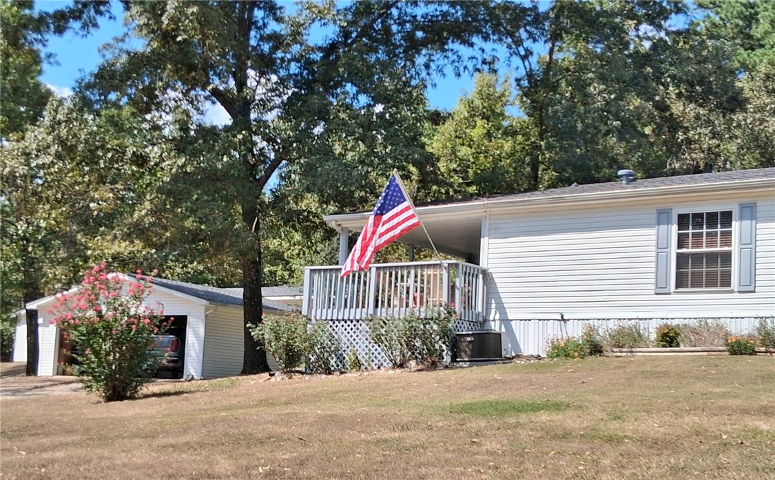 VERY PRIVATE 37.9 acres m/l with Double-Wide mobile home just minutes from Yellville.
Escape to peace and privacy with this very well-maintained 3-bedroom, 2.5-bath home nestled on 37.9 acres of mostly wooded land to enjoy the best of both worlds.
This beautiful, spacious home offers comfortable living with a split floor plan, open kitchen and living areas with plenty of natural light. Step outside and explore everything this unique property has to offer; excellent hunting for deer, turkey & hog; private pond, riding trails, and raised garden beds.
The property also features a two-car garage, three-bay workshop offering plenty of storage for outdoor equipment, along with a concrete storm shelter.
Whether you are looking for a private homestead, a recreational retreat, or just a place to unwind and enjoy nature, this property offers endless possibilities. NO restrictions, room to roam, and serene natural surroundings make this a rare find so close to town.