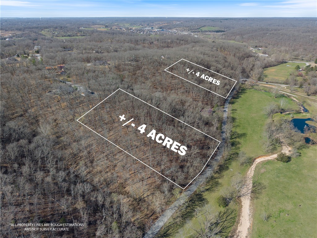 Discover +/- 8 acres of wooded land for sale just outside of Bentonville, offering the perfect opportunity to build your dream home in a peaceful yet convenient location. Situated near E McNelly Rd, this property is approx. 1.5 miles from US 71 Highway and just 2 miles from I-49, ensuring easy access to nearby amenities, shopping, and dining. Located within the highly sought-after Bentonville School District, this land provides an excellent investment in a rapidly growing area. The +/- 8 acres are divided into two +/- 4 acre lots, with approx. 5 acres of separation in between. Don't miss out on this prime piece of land in a thriving Northwest Arkansas Community!