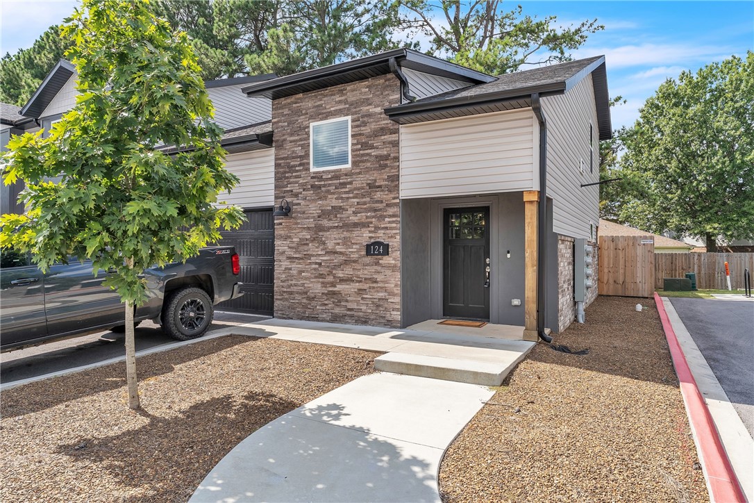 Needing a short term fully furnished rental? Lease for a minimum of only 3 months and up to 8 months. Available January 1, 2026, this beautiful fully furnished townhome offers an excellent Fayetteville location close to the University of Arkansas, shopping, trails, I-49, and all that Northwest Arkansas has to offer. The main level features an open living area, kitchen, laundry, and half bath, while upstairs you’ll find two large bedrooms each with a private bath, plus a large storage room over the garage. Interior finishes include LVP flooring in main areas with carpet on the stairs and in bedrooms, along with ceiling fans in the living room and bedrooms. The kitchen is equipped with stainless steel appliances, and a refrigerator, full-size washer, and dryer are included. Additional amenities include a Bluetooth speaker system in the living area and covered porch, as well as Wi-Fi security cameras. A two-car garage is attached, and the HOA fee is paid by the owner; tenants are responsible for utilities.