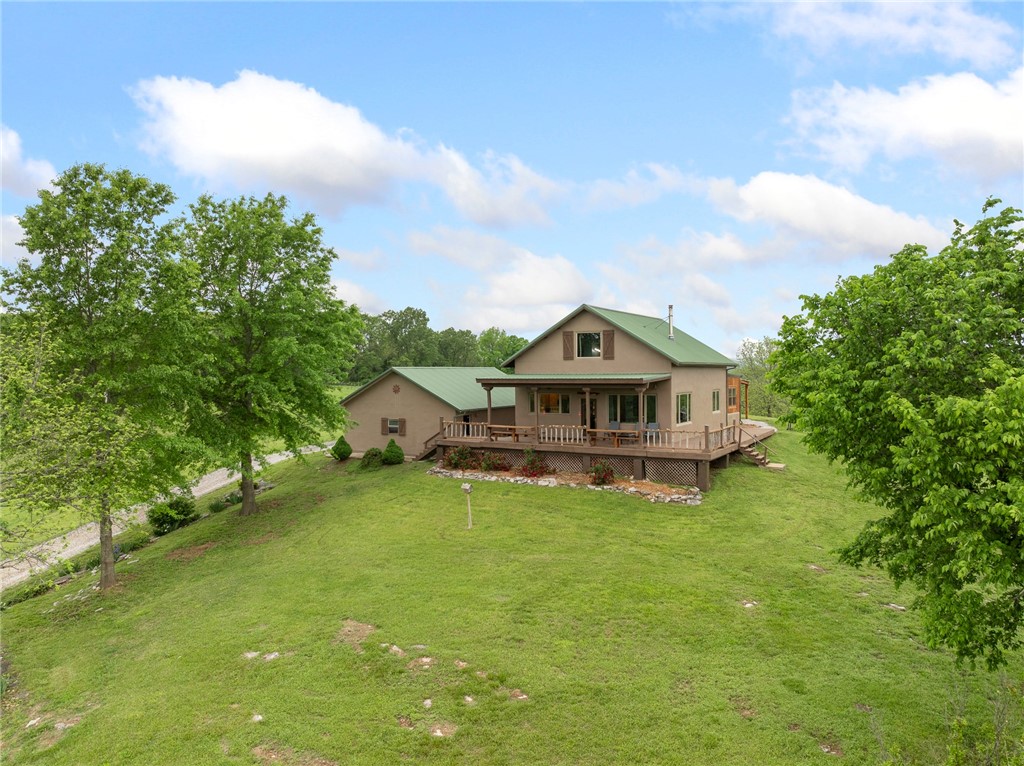 Sitting amongst the grandeur of the Ozark mountains is this hidden gem of a ranch 2 miles from Gilbert Arkansas. Whether you are homesteader, an investor or just a family looking for that adventurous family retreat, this place hits the nail on the head. Sitting on top of the highest ground with a panoramic view for miles is the main 3 bed 2 bath energy efficient home with 3 car garage. There is a well established Airbnb/Vrbo 2 bed 1 and half bath A frame nightly rental cabin also on the ranch. This 74 acre ranch is fenced off into 8 paddocks with two ponds and access to well water in every pasture. For those looking to sustain a family with healthy homegrown food there is an established half acre garden and orchard along with enclosures for livestock and large chicken coops. There are cattle corrals and a squeeze. Two barns, one 30x48 hay barn, a 30x34 shop barn with water and electricity and so much more. Quick 2 minute drive to the Buffalo National River for floating or hiking and horseback riding trails.