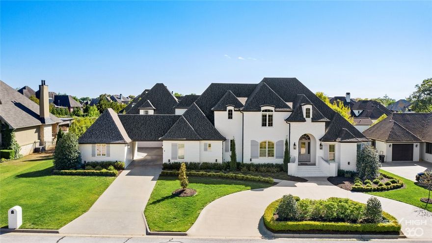 Timeless 7,169 square foot Pinnacle Country Club estate situated on 0.54 acre in Bentonville school district. Two-story entryway with a beautiful staircase is flanked by a private executive office with fireplace & spacious formal dining room. Large main living room opens to the chef’s kitchen featuring top-of-the-line appliances, a large center island, elegant marble countertops, floor to ceiling cabinetry and breakfast room all with incredible views of the backyard oasis. The oversized main level owner’s suite has lovely views of the pool and features a luxurious spa-like bathroom & large walk-in closet with convenient washer & dryer. This home has 2 bedrooms on the main level & upstairs offers 3 bedrooms with en-suite bathrooms, theater/game room, 1/2 bathroom and bonus room. The backyard is the perfect place for both relaxing & entertaining under the large covered patio overlooking the oversized European style pool with lush mature landscaping making this backyard a private paradise.