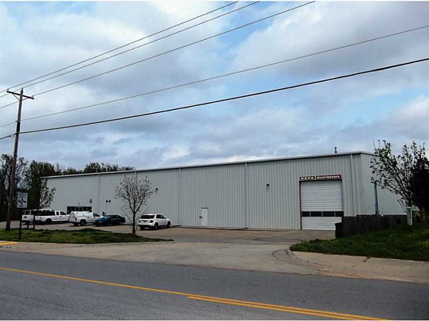 Great Warehouse with 3 High Dock Doors, 1 Large Drive In, 28' Sidewalls, 2 Large Restrooms.
