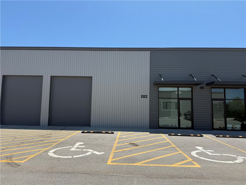 This newly constructed flex space warehouse is available for lease in a prime Cave Springs location, just off Highway 112. This versatile commercial property is fully built-out and features two 10'x14' overhead garage doors with a loading dock, three private offices, a bathroom, a welcoming office lobby, and a convenient kitchenette. It’s an excellent opportunity in a high-visibility, easily accessible area.