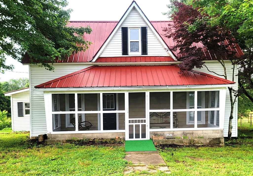 Check out this adorable country farm house with a major facelift. LOTS of updates include brand new septic, new water heater, 2 all new bathrooms, tile walk-in shower, all new LVP flooring throughout, new kitchen cabinet facing, countertops and appliances, HVAC is only 7 years old, including newer windows, new plumbing, new outside water lines and water meter, screened in front porch and a metal roof. Fenced on 3 sides and surrounded by neighboring farmland. Enjoy the country view with the porch swing included. Great location and priced to sell!