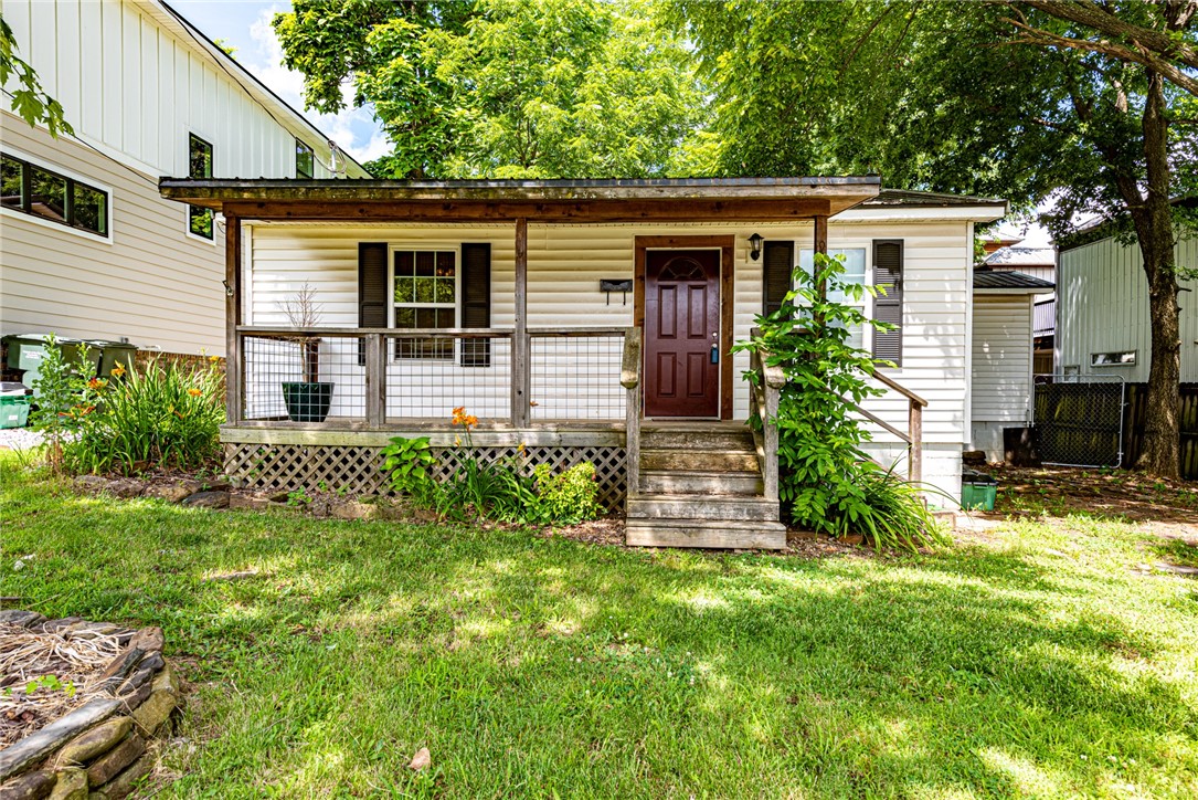 ATTN INVESTORS & FIRST TIME HOME BUYERS! Check out this super cute cottagesque 2 bedroom 2 bathroom just a short distance from the University of Arkansas! From the gorgeous front porch deck head inside to the main living space with beautiful hardwood flooring throughout! Flow into the kitchen with eat-in dining room, countertop bar perfect for coffee, U-shaped design with lots of counter top space! 2 spacious bedrooms and 2 full bathrooms! Entertain like a pro this summer on the back deck in the large backyard! PLUS storage building perfect for yard maintenance equipment! Act now!