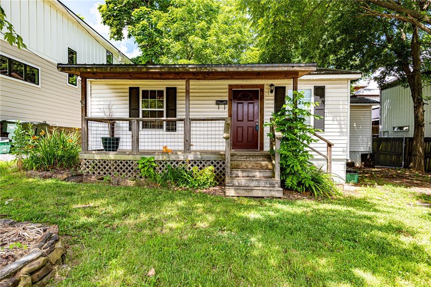ATTN INVESTORS & FIRST TIME HOME BUYERS! Check out this super cute cottagesque 2 bedroom 2 bathroom just a short distance from the University of Arkansas! From the gorgeous front porch deck head inside to the main living space with beautiful hardwood flooring throughout! Flow into the kitchen with eat-in dining room, countertop bar perfect for coffee, U-shaped design with lots of counter top space! 2 spacious bedrooms and 2 full bathrooms! Entertain like a pro this summer on the back deck in the large backyard! PLUS storage building perfect for yard maintenance equipment! Act now!