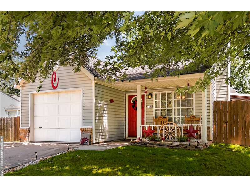 This adorable home would be a great starter home or an investment. It has a nice size living room with a very attractive wood burning fireplace and a kitchen just off of it. The dining area is adjacent from the kitchen & living room providing an open,feel perfect for gatherings. It has a nice backyard that wraps around the house with lots of room for outdoor activities, and a covered patio for relaxing. Located close to the U of A with easy access to I-49, restaurants, shopping & parks. CHARMING!