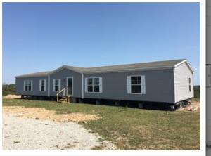 This 16 acres m/l located 0.2 miles on gravel includes a 4 bedroom 2 bath mobile home.