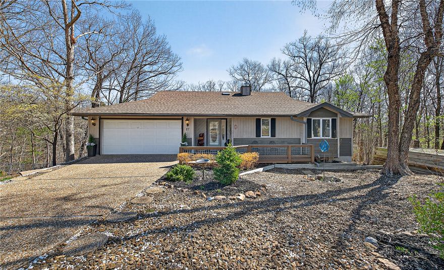 Tucked into the natural beauty of Bella Vista, this well-maintained two-level home offers 3 bedrooms and 3 full bathrooms. The main level welcomes you with a warm, inviting atmosphere and flows seamlessly into an all-seasons room—perfect for additional dining space, morning coffee, or enjoying the surrounding views year-round. The kitchen has been thoughtfully updated with new quartz countertops while the bathrooms feature refreshed, modern finishes that enhance the home’s overall appeal. Downstairs, a spacious entertainment and hangout area provides the perfect retreat including a private bedroom and full bathroom, making it a perfect setup for guests, extended family, or even a quiet home office suite. Major updates have already been taken care of, including a new roof and water heater installed in 2019, along with a recently replaced furnace—giving you added confidence and value. Whether you're looking for a full-time residence or a peaceful getaway, this home offers space, versatility, and thoughtful updates.