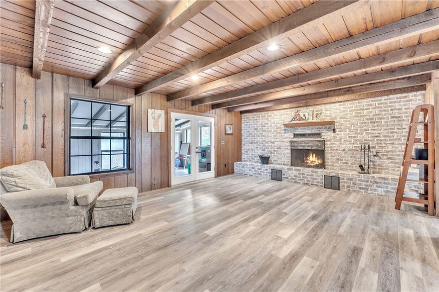 Looking for privacy while still close to town & amenities? Look no further! This 2,121 sq ft, 3-bed 2.5-bath home blends timeless character & thoughtful updates with room to make it your own. The entryway showcases brick flooring, repurposed from Farmington’s historic firehouse, setting the tone for the unique details found throughout. The spacious living room, anchored by a wood-burning fireplace, flows seamlessly into an eat-in kitchen & a dedicated dining area. Built-ins separate the kitchen from the dining area, adding charm & extra storage. Off the kitchen, the laundry room w/ pantry space provides backyard access & a half bath adds everyday convenience. The primary suite is a cozy retreat with an ensuite, fireplace, recently renovated walk-in closet & functional shutters.Through double doors off the living room, you'll find a sunroom overlooking the backyard, where a dry creek adds scenic charm. With beautiful details & an inviting layout, this home offers comfort, character & convenience all in one.