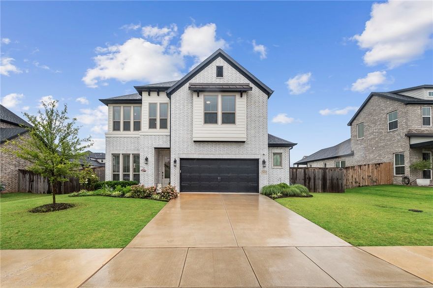 This one just feels right the moment you walk in. Clean lines, soaring ceilings, natural light, and a layout that truly works for real life. The open living, dining, and kitchen space is where everyone naturally gathers with quartz countertops, oversized island seating, pantry storage, modern finishes, and connected sightlines throughout. Living room built-ins add style and function, while the extra garage kickout offers valuable storage.

The private primary suite features a bay window sitting area, spa-inspired bath, soaking tub, walk-in tiled shower, and oversized closets. Upstairs bonus room offers flexibility for a media room, office, gym, playroom, or second living area.

Outside, enjoy the extended covered patio, fenced backyard, EV charger, and 220v patio plug. Perfect for entertaining, relaxing evenings, and everyday living. Near Bentonville schools, shopping, dining, parks, and quick I-49 access. Hot tub does not convey.