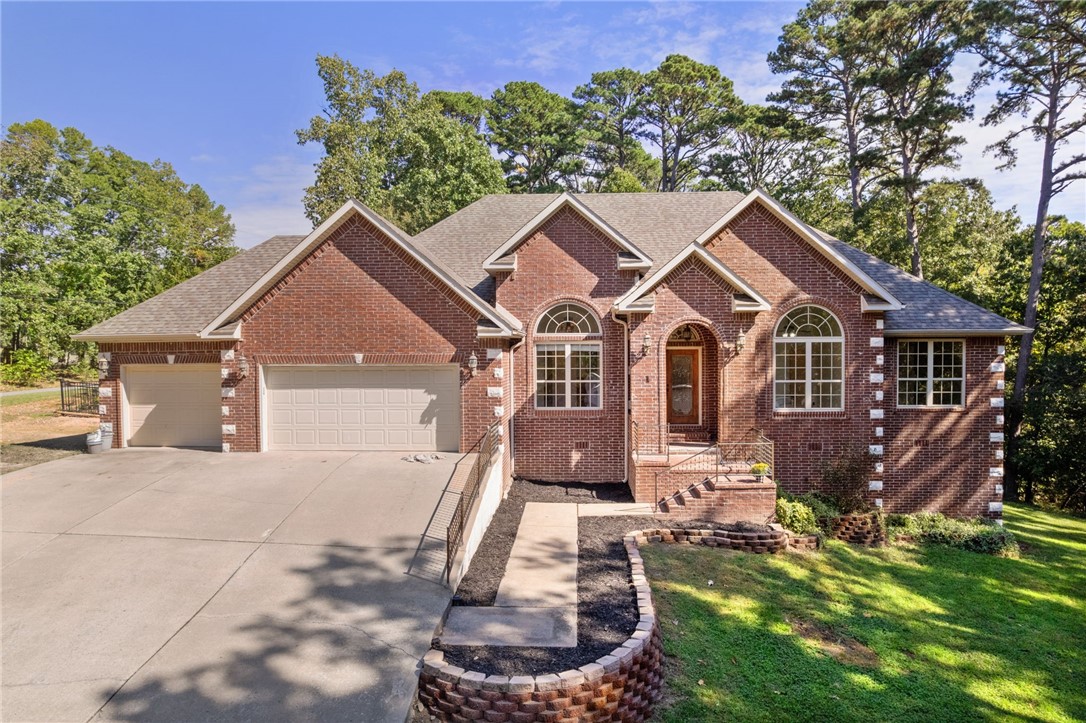 Spacious 4BR/2BA home on 1.7 acres (3 lots total), with the option to purchase two additional adjacent lots, adding 0.78 acres MLS:#1325527. Combined, this offers a rare opportunity to almost own the entire cul-de-sac. Home features new carpet and interior paint, plus a 1-year-old spa-pool combo and sauna. Open layout with high ceilings, a gas fireplace, and a large eat-in kitchen with stainless steel appliances. The primary suite includes a dual vanity, walk-in shower, and jetted tub. Enjoy wooded views from the sunroom or relax on the patio beside the spa. Quiet setting near trails, golf, and Bentonville schools.