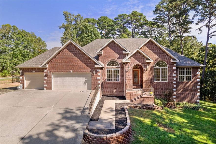 Spacious 4BR/2BA home on 1.7 acres (3 lots total), with the option to purchase two additional adjacent lots, adding 0.78 acres MLS:#1325527. Combined, this offers a rare opportunity to almost own the entire cul-de-sac. Home features new carpet and interior paint, plus a 1-year-old spa-pool combo and sauna. Open layout with high ceilings, a gas fireplace, and a large eat-in kitchen with stainless steel appliances. The primary suite includes a dual vanity, walk-in shower, and jetted tub. Enjoy wooded views from the sunroom or relax on the patio beside the spa. Quiet setting near trails, golf, and Bentonville schools.