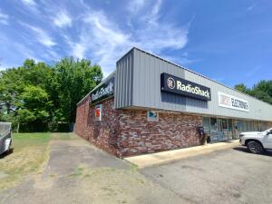 PRIME LOCATION & SUPERBLY CONSTRUCTED!!! Immediately off Exit 55-- this 7,500 square foot steel building is now for sale. First time on the market! Free standing steel building is currently housing a Radio Shack, middle open unit, and an apartment. It is a 3 tiered structure. The interior walls can be removed to have an open structure. Incredibly priced, below market value, owner is ready for travel and adventure. See specific showing instructions in Private Remarks.