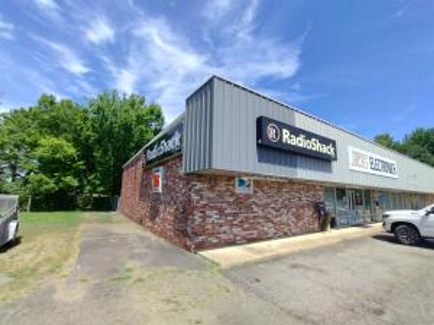 PRIME LOCATION & SUPERBLY CONSTRUCTED!!! Immediately off Exit 55-- this 7,500 square foot steel building is now for sale. First time on the market!  Free standing steel building is currently housing a Radio Shack, middle open unit, and an apartment. It is a 3 tiered structure. The interior walls can be removed to have an open structure. Incredibly priced, below market value, owner is ready for travel and adventure. See specific showing instructions in Private Remarks.