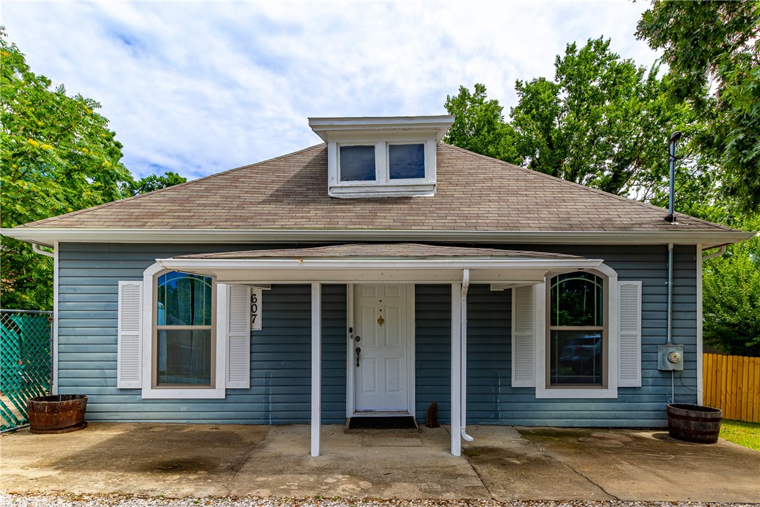 Walk to the restaurants and entertainment in Downtown Rogers from this updated cottage with an expansive back deck overlooking your back yard. You will find a nice tree barrier beyond the new wood privacy fence. HVAC and ductwork in 2020, roof 7 years old, paint, appliances, bath including shower, flooring, tankless water heater all in 2020. See this home today and make it yours!
