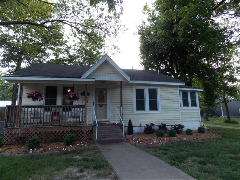Downtown cottage. New in last six years: siding (with lifetime warranty), windows, front porch, roof, heat and air, with new duct work, flooring, interior paint, light fixtures, kitchen counters and backsplash, stainless appliances, and more.,Small but adorable downtown cottage with front porch, complete with rocking chairs! Charming opportunity to be in the center of all that is happening in downtown. Fenced yard. Detached garage.