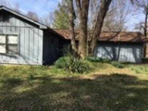 Affordable! Cozy! Quaint! Like to fish? Arkansas river is less than 1/4 mile away! Solidly built house is constructed of 8'' x 8'' sawn timbers, sheathed with wood siding. One acre CORNER lot! Mature trees. Roomy 1056 square feet in this 2BR/1BA house conveniently located only minutes from I-40 or downtown Clarksville! Payments cheaper than rent! This house is a must-see!