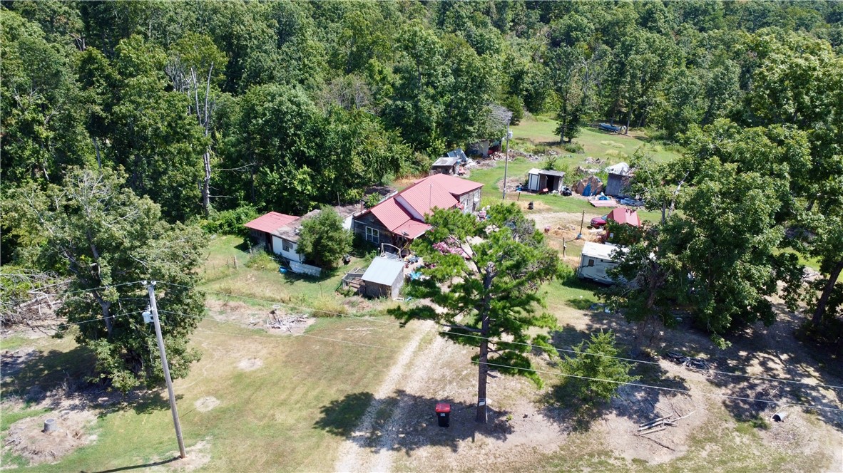 Own a beautiful 5 acres only 15 minutes from Beaver Lake and 30 minutes to Eureka Springs and 5 min from War Eagle. Plenty of room to build your dream home and be surrounded by nature.
Septic, Water and Electricity all on site. Home and buildings on property hold no value, value is in land only.